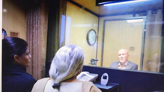 Former Indian Navy officer Kulbhushan Jadhav's wife and mother meet him while seated across a glass partition at the Pakistan foreign office in Islamabad on Monday. (PTI) Former Indian Navy officer Kulbhushan Jadhav's wife and mother meet him while seated across a glass partition at the Pakistan foreign office in Islamabad on Monday. (PTI)