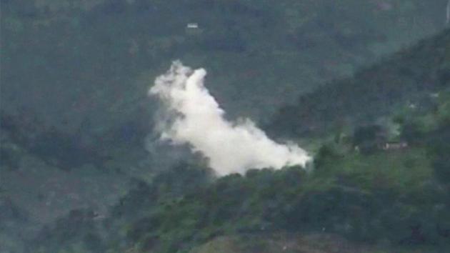 Smoke rises after a mortar shell is fired by the Pakistani Army near the Line of Control at Shahpur and Degwar areas, in Jammu and Kashmir's Poonch district.(PTI FILE)