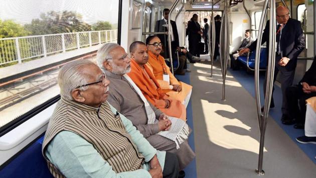 Prime Minister Narendra Modi rides the newly inaugurated magenta metro line from Botanical Garden station to Okhla Bird Sanctuary along with the Uttar Pradesh governor Ram Naik and state chief minister Yogi Adityanath at Noida on Monday. (PTI Photo) Prime Minister Narendra Modi rides the newly inaugurated magenta metro line from Botanical Garden station to Okhla Bird Sanctuary along with the Uttar Pradesh governor Ram Naik and state chief minister Yogi Adityanath at Noida on Monday. (PTI Photo)