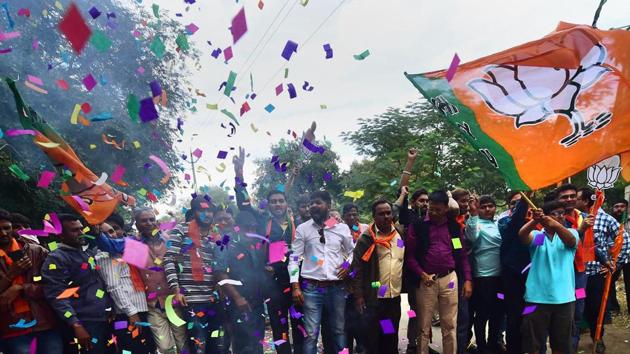 BJP supporters burst firecrackers to celebrate the party's victory in Gujarat assembly elections in Gandhinagar. (PTI) BJP supporters burst firecrackers to celebrate the party's victory in Gujarat assembly elections in Gandhinagar. (PTI)