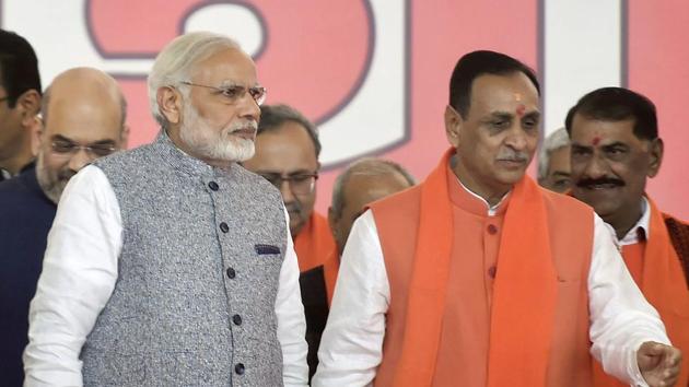 Prime Minister Narendra Modi along with chief minister Vijay Rupani and BJP president Amit Shah during the swearing-in ceremony at Gandhinagar, Ahmedabad on Tuesday (PTI Photo) Prime Minister Narendra Modi along with chief minister Vijay Rupani and BJP president Amit Shah during the swearing-in ceremony at Gandhinagar, Ahmedabad on Tuesday (PTI Photo)