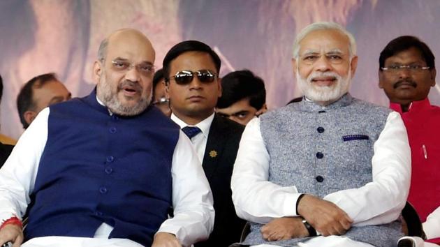 Prime Minister Narendra Modi and BJP president Amit Shah during the swearing-in ceremony of the new Gujarat government in Gandhinagar on Tuesday.(PTI)