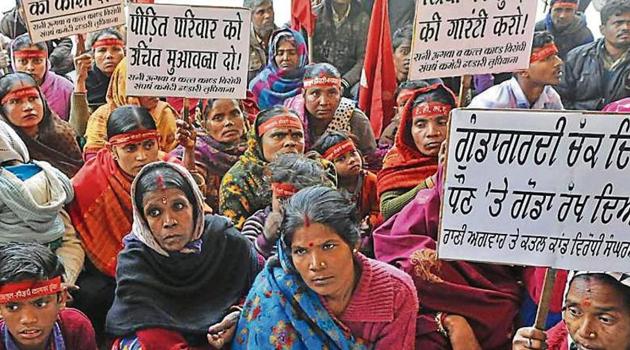 Victim’s family during a protest demanding compensation outside DC office in Ludhiana on Tuesday. (Gurminder Singh/HT) Victim’s family during a protest demanding compensation outside DC office in Ludhiana on Tuesday. (Gurminder Singh/HT)