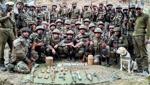 Army and J&K Police display the recovered arms and ammunition from a hideout concealed in the rugged terrain along the Pir Panjal range, Reasi district of Jammu region on Wednesday. (PTI) Army and J&K Police display the recovered arms and ammunition from a hideout concealed in the rugged terrain along the Pir Panjal range, Reasi district of Jammu region on Wednesday. (PTI)