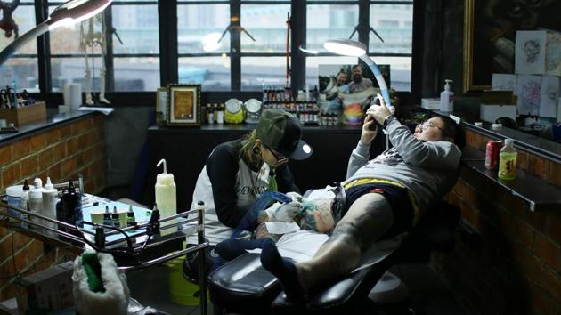 Tattoos are still frowned upon in government positions and at many companies. Peng Lin, 31, works in advertising and is one of few in her circle with a tattoo, but many are considering it, she said. “Before, people may think women getting tattoos is sort of off-the-mainstream behaviour, but now they all appreciate them when they find out that tattoos can be pretty and artsy,” Peng said. (AFP)