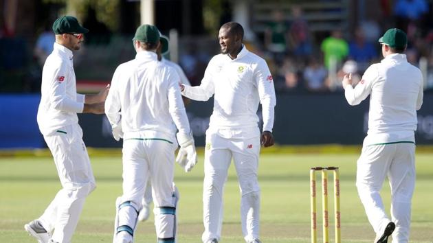 South African bowler Andile Phehlukwayo (2R) celebrates the dismissal of Zimbabwean batsman Peter Moor (not in picture) during the second day of the day-night Test cricket match between South Africa and Zimbabwe at St George's Park Cricket Ground in Port Elizabeth on December 27, 2017. Zimbabwe lost by an innings and 120 runs.(AFP)