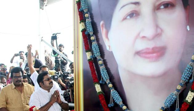 Sidelined AIADMK leader TT V Dhinakaran pays tribute at the memorial of J Jayalalithaa after winning the RK Nagar constituency bypoll, at Marina in Chennai. (PTI) Sidelined AIADMK leader TT V Dhinakaran pays tribute at the memorial of J Jayalalithaa after winning the RK Nagar constituency bypoll, at Marina in Chennai. (PTI)