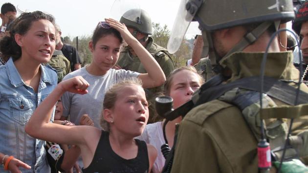 And in 2012, when she was 11, she was photographed raising her fist and yelling at another Israeli soldier — an action that earned her the Hanzala Courage Award award from Turkey and a meeting with Turkish President Recep Tayyip Erdogan. That her family appears to encourage these confrontations with Israeli soldiers offends some Palestinians and has enraged many Israelis. (Abbas Momani / AFP File) And in 2012, when she was 11, she was photographed raising her fist and yelling at another Israeli soldier — an action that earned her the Hanzala Courage Award award from Turkey and a meeting with Turkish President Recep Tayyip Erdogan. That her family appears to encourage these confrontations with Israeli soldiers offends some Palestinians and has enraged many Israelis. (Abbas Momani / AFP File)