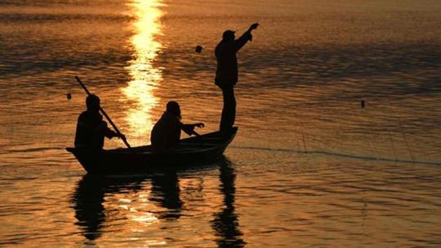 File photo of fishermen on the Brahmaputra river at sunset in Guwahati on December 7, 2017. (AFP) File photo of fishermen on the Brahmaputra river at sunset in Guwahati on December 7, 2017. (AFP)