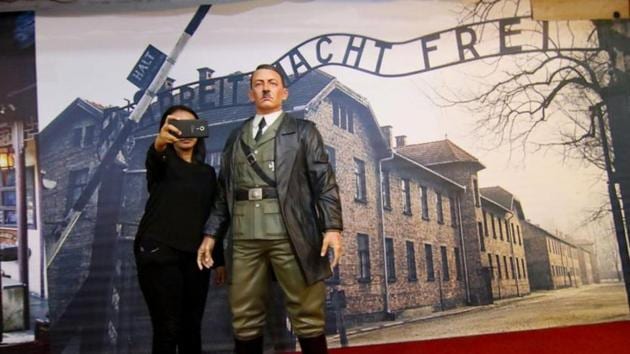 This photograph taken on November 10, 2017 shows an Indonesian woman take a selfie with a life-size wax sculpture of Adolf Hitler at a museum in Yogyakarta. (AFP) This photograph taken on November 10, 2017 shows an Indonesian woman take a selfie with a life-size wax sculpture of Adolf Hitler at a museum in Yogyakarta. (AFP)