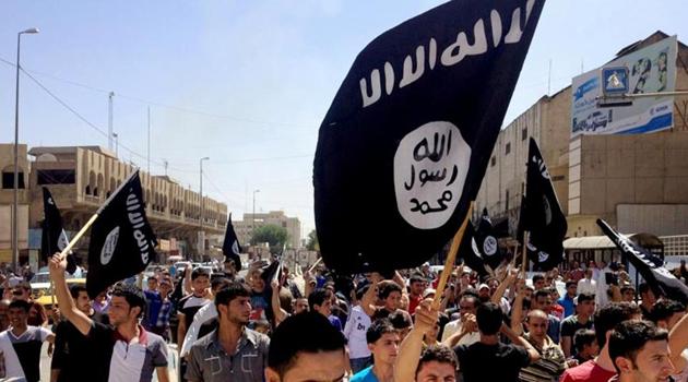 In this file photo, demonstrators chant pro-Islamic State group slogans as they wave the group’s flags. (AP File Photo) In this file photo, demonstrators chant pro-Islamic State group slogans as they wave the group’s flags. (AP File Photo)