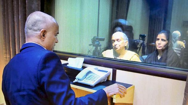 Former Indian Navy officer Kulbhushan Jadhav’s wife and mother meet him while seated across a glass partition at the Pakistan Foreign Office in Islamabad on Monday. (PTI Photo) Former Indian Navy officer Kulbhushan Jadhav’s wife and mother meet him while seated across a glass partition at the Pakistan Foreign Office in Islamabad on Monday. (PTI Photo)