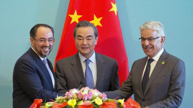 Afghan foreign minister Salahuddin Rabbani, Chinese foreign minister Wang Yi and Pakistani foreign minister Khawaja Asif attend a joint news conference after the 1st China-Afghanistan-Pakistan Foreign Ministers’ Dialogue in China (AP) Afghan foreign minister Salahuddin Rabbani, Chinese foreign minister Wang Yi and Pakistani foreign minister Khawaja Asif attend a joint news conference after the 1st China-Afghanistan-Pakistan Foreign Ministers’ Dialogue in China (AP)