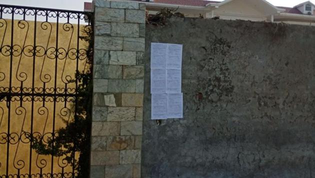 Recovery notices pasted by PADB officials outside former SAD minister Raghubir Singh’s house in Kapurthala on Thursday. (HT Photo) Recovery notices pasted by PADB officials outside former SAD minister Raghubir Singh’s house in Kapurthala on Thursday. (HT Photo)