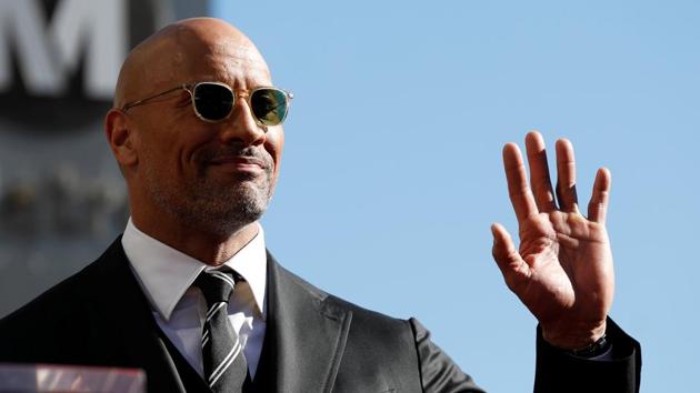 Actor Dwayne Johnson waves before unveiling his star on the Hollywood Walk of Fame in Los Angeles. (REUTERS) Actor Dwayne Johnson waves before unveiling his star on the Hollywood Walk of Fame in Los Angeles. (REUTERS)