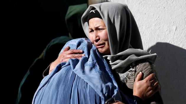 Afghan women mourn at a hospital after the suicide attacks. Photographs sent by witnesses showed what appeared to be serious damage at the site, in a heavily Shiite Muslim area in the west of the capital, and a number of dead and wounded on the ground. (Mohammad Ismail / REUTERS)