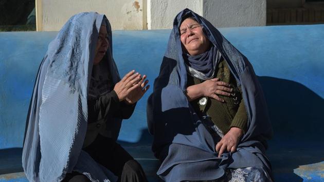 Afghan women weep for relatives at a hospital following explosions at a Shiite cultural centre in Kabul on December 28, 2017. At least 41 people were killed and dozens more wounded in multiple blasts in Kabul on December 28, officials said, in the latest deadly violence to hit the Afghan capital. (Shah Marai / AFP)