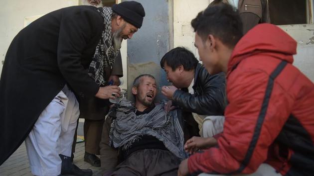 An Afghan man weeps for his relatives at a hospital following explosions at a Shiite cultural centre in Kabul. According to a report this month by media freedom group Reporters without Borders, Afghanistan is among the world’s most dangerous countries for media workers with two journalists and five media assistants killed doing their jobs in 2017, before Thursday’s attack. (Shah Marai / AFP)
