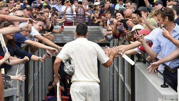 As Cook walked off to the pavilion at stumps, the entire Melbourne Cricket Ground rose to acknowledge the marathon innings he played. (AP) 