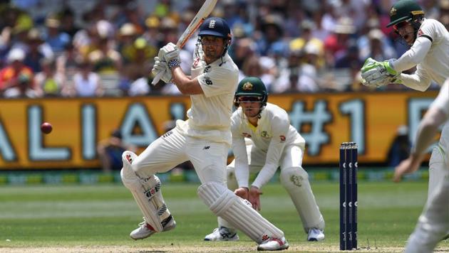 England's batsman Alastair Cook cuts a ball away as Australia's Cameron Bancroft (C) and Tim Paine (R) look on, on the third day of the fourth Ashes cricket Test match in Melbourne on December 28, 2017. (AFP) England's batsman Alastair Cook cuts a ball away as Australia's Cameron Bancroft (C) and Tim Paine (R) look on, on the third day of the fourth Ashes cricket Test match in Melbourne on December 28, 2017. (AFP)