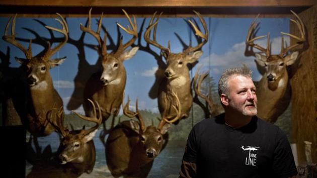 Dale Ferguson stands in his hunting cabin decorated with deer as he prepares to go out on a hunt. Ferguson has three priorities in life and in politics, in this order: God, guns, family. Like it used to be, he says. And now he sees himself reflected in America’s president. (David Goldman / AP) Dale Ferguson stands in his hunting cabin decorated with deer as he prepares to go out on a hunt. Ferguson has three priorities in life and in politics, in this order: God, guns, family. Like it used to be, he says. And now he sees himself reflected in America’s president. (David Goldman / AP)