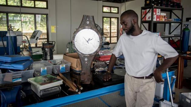 Awuah-Darko’s first upcycled work is a grandfather clock made from a galvanised car axle, aluminium and part of a discarded wall clock. Two high-end hotels in Accra are currently vying to buy the unusual timepiece, he said, and with such interest he plans to create more and expand operations. Joseph looks up to a future where more than 100 people from Agbogbloshie can leave this dangerous work to build furniture. (Cristina Aldehuela / AFP) 