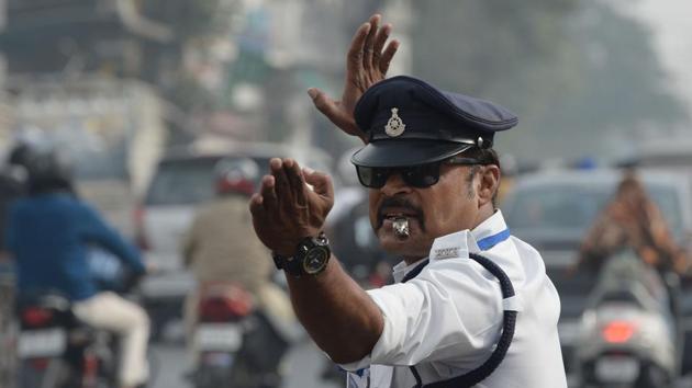 “I have been a Michael Jackson fan for years and copied his moonwalk step to halt traffic 12 years ago,” Singh told AFP. “Initially, people were surprised, but it worked wonders over the years and has gained popularity.” (Indranil Mukherjee / AFP)