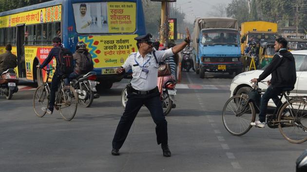 “It’s a tiring task maintaining traffic amid noise pollution and reckless motorists but moonwalking amuses commuters and drivers,” Singh added. (Indranil Mukherjee / AFP)