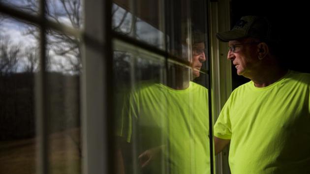 Reggie Dickerson looks out his home in Sandy Hook. “I would love for him to come here, see the people, what’s been taken from them, and help restore it.” His community suffered a one-two punch, he says. It lost the tobacco industry, and then coal. Families left dependent on welfare, and now they’re depending on Trump to revive coal -- and manufacturing across the country-- and bring back work. (David Goldman / AP) Reggie Dickerson looks out his home in Sandy Hook. “I would love for him to come here, see the people, what’s been taken from them, and help restore it.” His community suffered a one-two punch, he says. It lost the tobacco industry, and then coal. Families left dependent on welfare, and now they’re depending on Trump to revive coal -- and manufacturing across the country-- and bring back work. (David Goldman / AP)