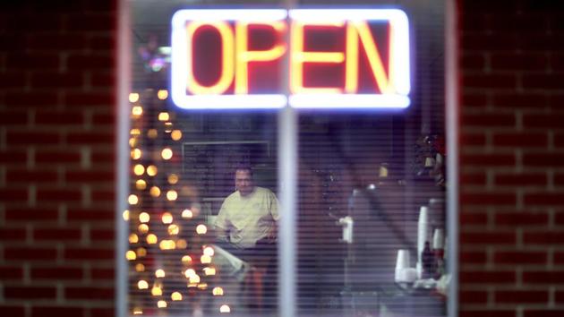 Steven Whitt opens the Frosty Freeze restaurant that he runs with his wife. His diner looks, sounds and smells the same as it did when it opened 50-years-ago. People like it that way, he thinks. It reminds them of a time before the world seemed to stray and when coal was king. “He was the hope we were all waiting on, the guy riding up on the white horse. There was a new energy about everybody here.” (David Goldman / AP) Steven Whitt opens the Frosty Freeze restaurant that he runs with his wife. His diner looks, sounds and smells the same as it did when it opened 50-years-ago. People like it that way, he thinks. It reminds them of a time before the world seemed to stray and when coal was king. “He was the hope we were all waiting on, the guy riding up on the white horse. There was a new energy about everybody here.” (David Goldman / AP)
