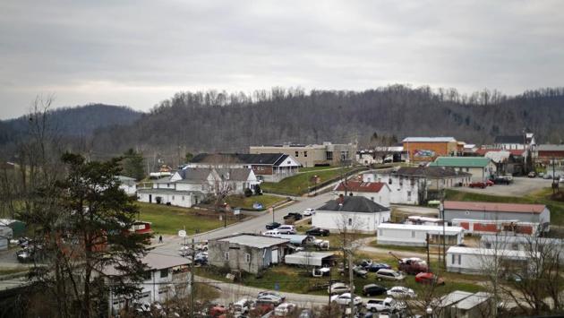 Main Street (C), cuts through Sandy Hook. Despite the president’s plummeting approval ratings, he remains profoundly popular in these mountains, a region so badly battered by the collapse of the coal industry it became the symbolic heart of Trump’s white working-class base. Many families can trace their ancestry back generations on the same land. Almost everyone is white, and almost everyone is Christian. (David Goldman / AP) Main Street (C), cuts through Sandy Hook. Despite the president’s plummeting approval ratings, he remains profoundly popular in these mountains, a region so badly battered by the collapse of the coal industry it became the symbolic heart of Trump’s white working-class base. Many families can trace their ancestry back generations on the same land. Almost everyone is white, and almost everyone is Christian. (David Goldman / AP)