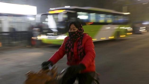 A woman wearing a mask rides a bicycle amid heavy smog in Beijing, China. (Reuters) A woman wearing a mask rides a bicycle amid heavy smog in Beijing, China. (Reuters)