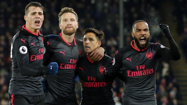Alexis Sanchez celebrates with his teammates after Arsenal’s victory over Crystal Palace in their Premier League encounter.(AP)