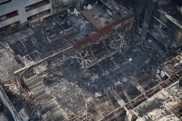 Charred remains of the restaurants at Kamala Mills compound, Lower Parel. (PTI) Charred remains of the restaurants at Kamala Mills compound, Lower Parel. (PTI)