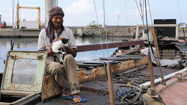 Zbigniew Reket, a Polish sailor who was rescued on December 25 in the Indian Ocean by the French coast guard, sits with his cat on his boat in Le Port, on the French overseas island of La Reunion. Reket told reporters he left the Comoros Islands off Africa’s east coast in May for South Africa. He also claims to have survived on half a packet of Chinese soup per day and whatever he caught by fishing. (Richard Bouhet / AFP) Zbigniew Reket, a Polish sailor who was rescued on December 25 in the Indian Ocean by the French coast guard, sits with his cat on his boat in Le Port, on the French overseas island of La Reunion. Reket told reporters he left the Comoros Islands off Africa’s east coast in May for South Africa. He also claims to have survived on half a packet of Chinese soup per day and whatever he caught by fishing. (Richard Bouhet / AFP)