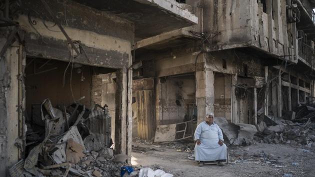 Shop owner Abu Azar sits outside a destroyed bazaar in the Old City. Corruption and bitter sectarian divisions make things harder. The areas with the worst destruction are largely Sunni, while the Baghdad government is Shiite-dominated. The fear is that if Sunni populations feel they’ve been abandoned and left to fend for themselves in shattered cities, the resentment will feed the next generation of militants. (Felipe Dana / AP) Shop owner Abu Azar sits outside a destroyed bazaar in the Old City. Corruption and bitter sectarian divisions make things harder. The areas with the worst destruction are largely Sunni, while the Baghdad government is Shiite-dominated. The fear is that if Sunni populations feel they’ve been abandoned and left to fend for themselves in shattered cities, the resentment will feed the next generation of militants. (Felipe Dana / AP)