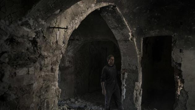 A construction worker stands in the destroyed old bazaar in Mosul. At the southern end of the district, arcades of stone-arched storefronts that once sold spices, cloth and household goods are charred and gutted. The Old City shows the densest destruction, but nearly every neighbourhood of western Mosul has blocks of blasted houses, industrial areas, government buildings and infrastructure. (Felipe Dana / AP) A construction worker stands in the destroyed old bazaar in Mosul. At the southern end of the district, arcades of stone-arched storefronts that once sold spices, cloth and household goods are charred and gutted. The Old City shows the densest destruction, but nearly every neighbourhood of western Mosul has blocks of blasted houses, industrial areas, government buildings and infrastructure. (Felipe Dana / AP)