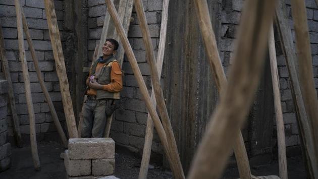 A construction worker smiles during a break as he rebuilds a destroyed shop in the Old City. Along its gutted roads, a handful of people are beginning to rebuild. Amar Ismail Brahim sold his wife’s gold to repaint his café without government aid. “We fought Daesh on behalf of the whole world,” he said. “Now is the time for them to stand with Mosul.” (Felipe Dana / AP) A construction worker smiles during a break as he rebuilds a destroyed shop in the Old City. Along its gutted roads, a handful of people are beginning to rebuild. Amar Ismail Brahim sold his wife’s gold to repaint his café without government aid. “We fought Daesh on behalf of the whole world,” he said. “Now is the time for them to stand with Mosul.” (Felipe Dana / AP)