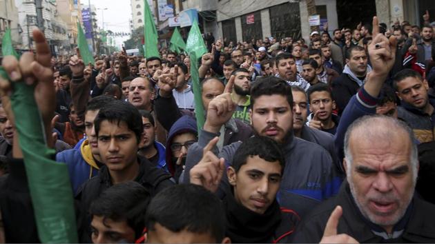 Hamas supporters chant slogans while raising their hands up during protest against US President Donald Trump's decision to recognize Jerusalem as Israel's capital, in Gaza City, Friday, Dec. 29, 2017. (AP) Hamas supporters chant slogans while raising their hands up during protest against US President Donald Trump's decision to recognize Jerusalem as Israel's capital, in Gaza City, Friday, Dec. 29, 2017. (AP)