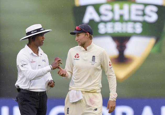 England's Joe Root, right, talks with umpire Kumar Dharmasena as rain interrupts play during the fourth day of their Ashes cricket test match against Australia in Melbourne, Australia, Friday, Dec. 29, 2017. (AP Photo/Andy Brownbill) (AP) England's Joe Root, right, talks with umpire Kumar Dharmasena as rain interrupts play during the fourth day of their Ashes cricket test match against Australia in Melbourne, Australia, Friday, Dec. 29, 2017. (AP Photo/Andy Brownbill) (AP)