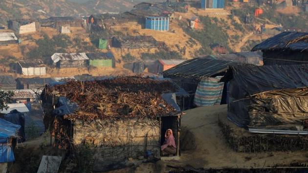 A Rohingya refugee woman looks out from her shelter at the Burma Para refugee camp near Cox's Bazar, Bangladesh. (Reuters) A Rohingya refugee woman looks out from her shelter at the Burma Para refugee camp near Cox's Bazar, Bangladesh. (Reuters)
