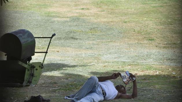 Any place is a good place to read: In a garden near Raj Ghat in New Delhi. (Sushil Kumar/HT PHOTO) Any place is a good place to read: In a garden near Raj Ghat in New Delhi. (Sushil Kumar/HT PHOTO)