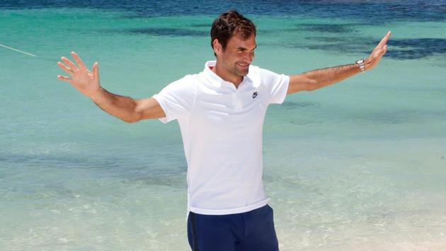 Roger Federer gestures as he walks along a beach at Rottnest Island off the coast of Western Australia on December 28, 2017. (AFP)