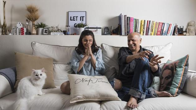 Actor Alia Bhatt (L) and her father filmmaker Mahesh Bhatt share a joke at their home in Juhu, Mumbai in June.  (Aalok Soni / HT Photo) 