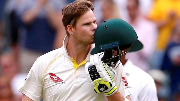 Australia captain Steve Smith kisses his helmet after reaching his century during the fifth day of the fourth Ashes Test against England in Melbourne on Saturday. (REUTERS) Australia captain Steve Smith kisses his helmet after reaching his century during the fifth day of the fourth Ashes Test against England in Melbourne on Saturday. (REUTERS)