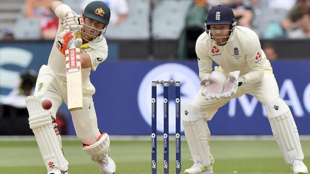 Australia's David Warner, left, drives the ball in front of England's Jonny Bairstow. (AP)