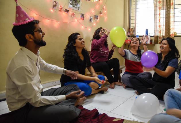 A group of friends prepare to ring in the New Year at their house in Aundh.(Sanket Wankhade/HT PHOTO)