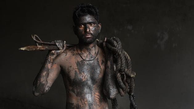Vikas, 25,  a sewage worker in Delhi. While the Supreme Court has criminalised entering sewers without safety gear even in emergency situations, the working environment for these sewer workers remains sordid.  (Ravi Choudhary / HT Photo) 