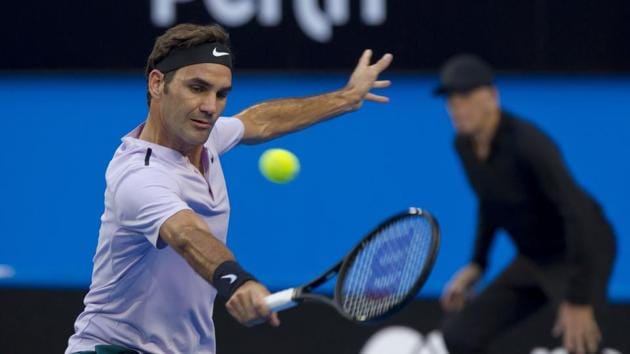 Roger Federer of Switzerland hits a return against Yuichi Sugita of Japan during their second session men's singles match on day one of the Hopman Cup tennis tournament in Perth on December 30, 2017. (AFP) Roger Federer of Switzerland hits a return against Yuichi Sugita of Japan during their second session men's singles match on day one of the Hopman Cup tennis tournament in Perth on December 30, 2017. (AFP)