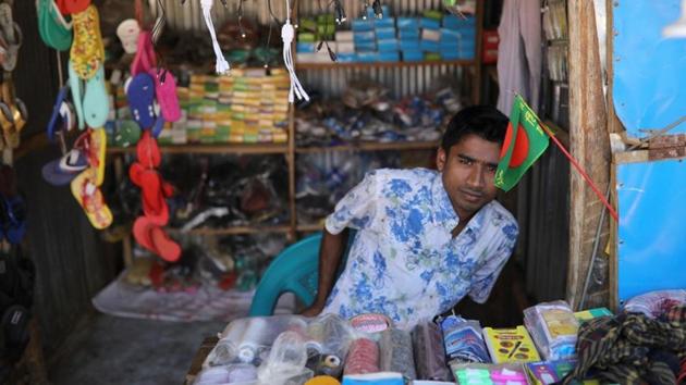 Saddam Hussein, 23, works at his family’s shop at the Kutupalong refugee camp. He lost touch with Shofika for a couple of weeks during the chaos of fleeing Rakhine state to safety in Bangladesh, but was eventually reunited with Shofika in Kutupalong camp. (Marko Djurica / REUTERS) Saddam Hussein, 23, works at his family’s shop at the Kutupalong refugee camp. He lost touch with Shofika for a couple of weeks during the chaos of fleeing Rakhine state to safety in Bangladesh, but was eventually reunited with Shofika in Kutupalong camp. (Marko Djurica / REUTERS)